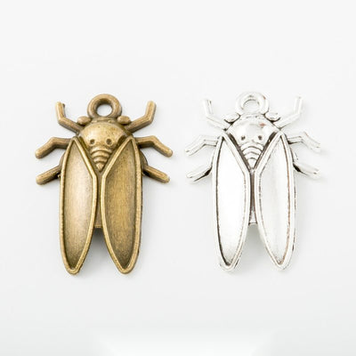 Grouped front views of cicada charms