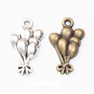 balloon bouquet metal charms in two antique finishes shown together in the available finishes