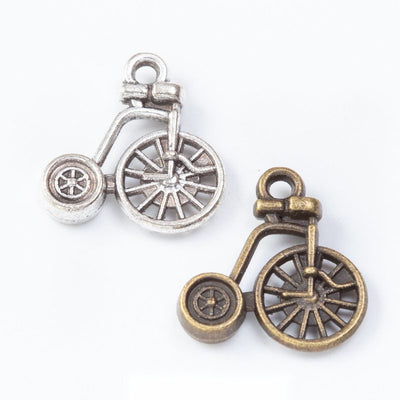 Penny Farthing Bicycle Charm Pendant finish comparison showing one large spoked wheel and one small rear wheel