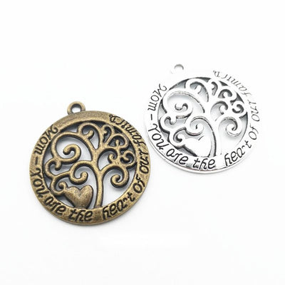 Tree of Life Medallion metal pieces shown in the available finishes.