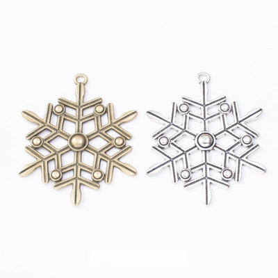 Snowflake charm shown across the available finishes