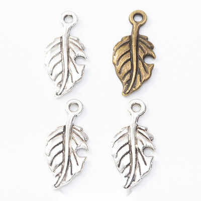 Product photo 1 of the veined leaf charm highlighting its slender leaf silhouette with raised central and side veins