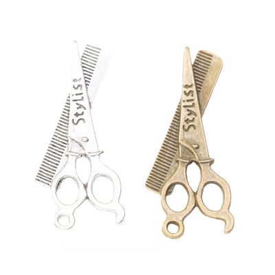 Front view of scissors and comb charm showing finish variation 1