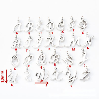 Script alphabet letter metal component, grouped front view on white
