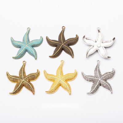 Overview of large starfish charm pieces on a white background