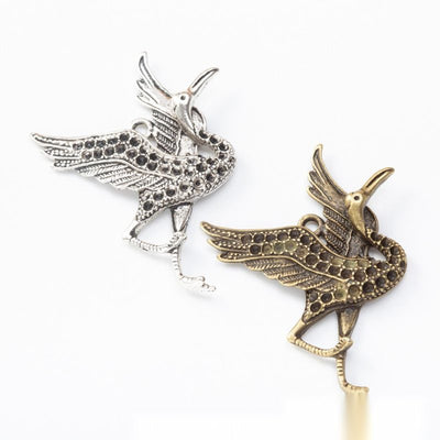 Long-Legged Crane Bird Metal Charm Pendant shown in the available visible finishes