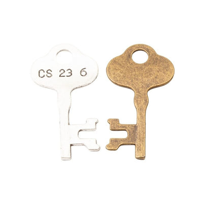 Grouped front views of vintage key charms