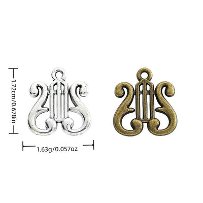 Lyre Instrument metal piece shown in Antique Bronze, Antique Silver beside printed specifications