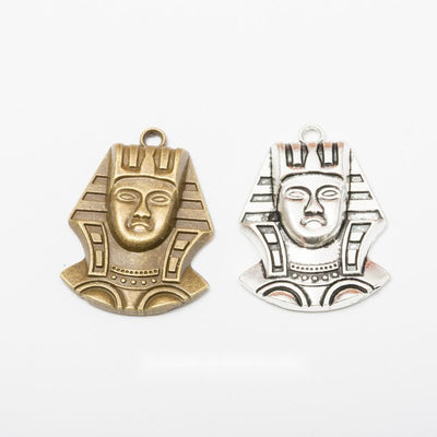 Egyptian Pharaoh Face metal design group view on a light background