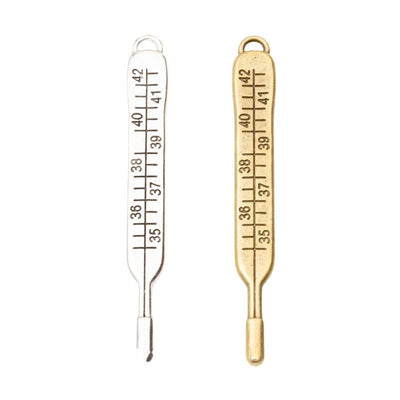 Product photo 1 of the thermometer charm highlighting its slender thermometer shape with engraved scale markings