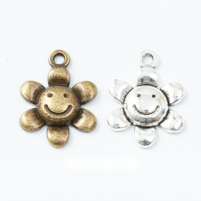 Smiling Sunflower Charm finish comparison on a white background
