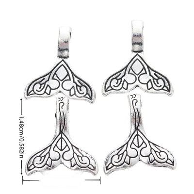 Product image showing the two loop whale tail connector charm and its visible metal details