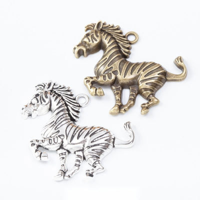 Running Horse Charm Pendant finish comparison showing a galloping horse with a flowing mane and tail