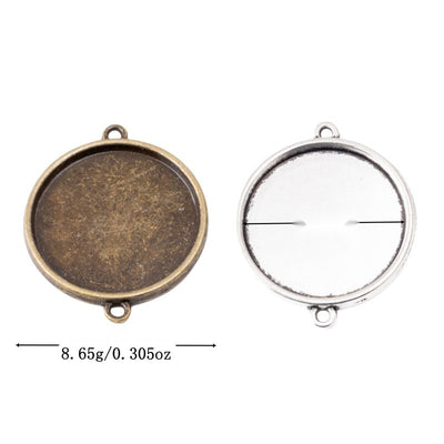 Group view of round recessed cabochon tray with loops at the top and bottom