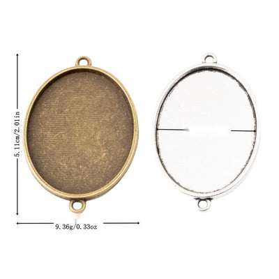 Group view of plain oval recessed cabochon tray with a single top loop