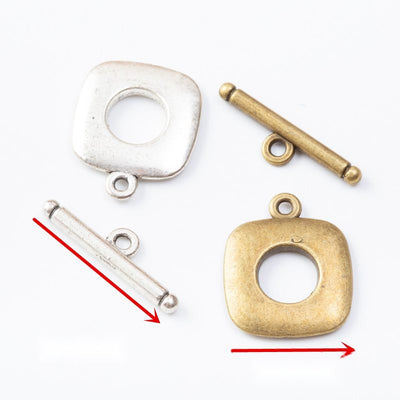 Front comparison of rounded square toggle clasp metal component in 2 finishes