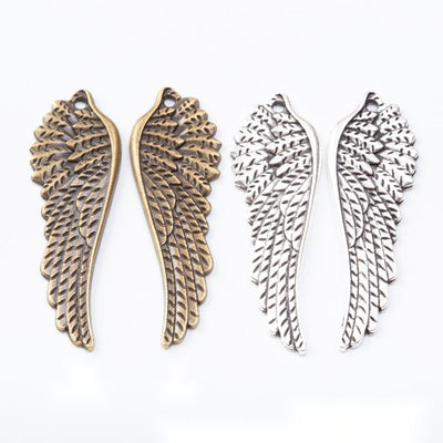 Feathered Angel Wing metal pieces shown in the available finishes.