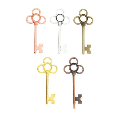 Group view showing the available finishes of four loop skeleton key charms