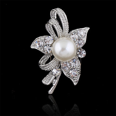 Front product view of the pearl crystal ribbon flower brooch pin in black and silver
