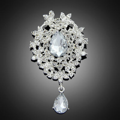Front product view of the teardrop crystal floral dangle brooch pin in silver and black