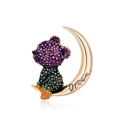 Front product view of the moon brooch pin in gold and purple