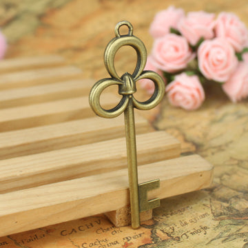 Long Triple Loop Floral Skeleton Key Charms in Three Finishes