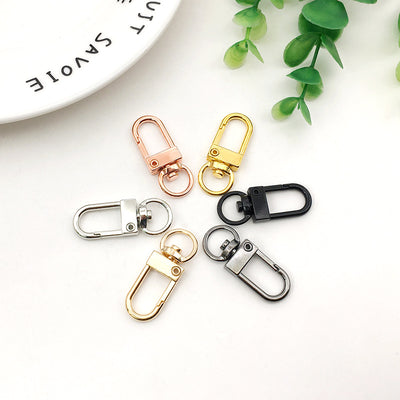 Metallic assorted shape jewelry findings arranged on a light background