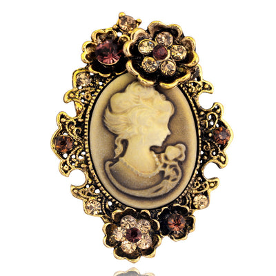 Front product view of the woman portrait brooch pin in gold and black