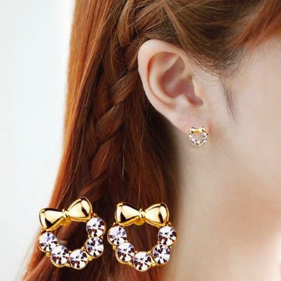 Primary supplied view of bow wreath stud and clip earrings