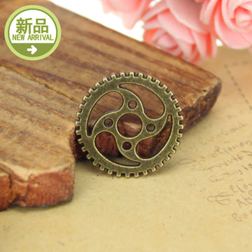 Round Swirl Gear Charm with Toothed Edge in Two Finishes