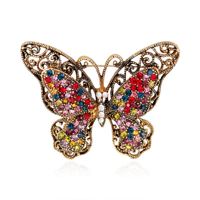 Front product view of the butterfly brooch pin in gold and red