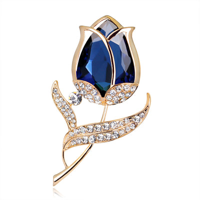 Front product view of the rose brooch pin in gold and blue