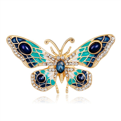 Front product view of the butterfly brooch pin in gold and blue
