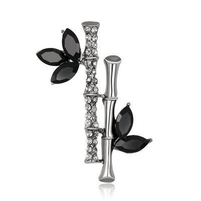 Front product view of the flower brooch pin in silver and black