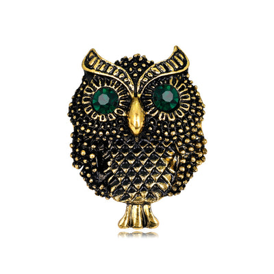 Front product view of the owl brooch pin in black and gold