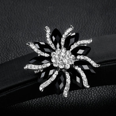 Front product view of the flower brooch pin in black and silver