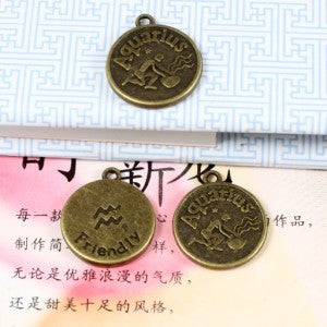 Aquarius Zodiac Round Medallion Charm In Multiple Metal Finishes
