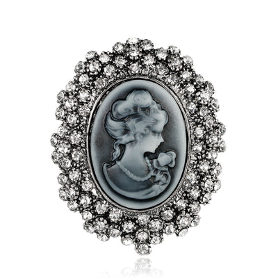 Front product view of the woman portrait brooch pin in silver and black