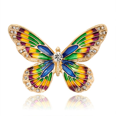 Front product view of the butterfly brooch pin in gold and green