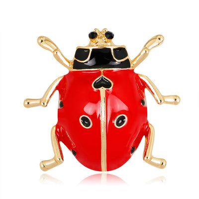 Front product view of the ladybug brooch pin in red and gold