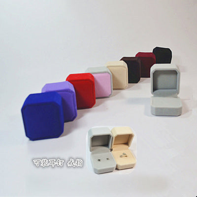 Ten color variants of compact square jewelry presentation boxes