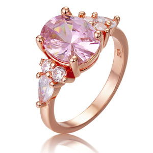 Rose Gold-Tone Pink Oval Ring With Clear Side Stones