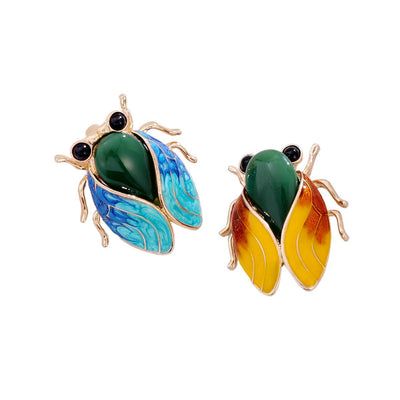 Front view of the blue cicada metal brooch
