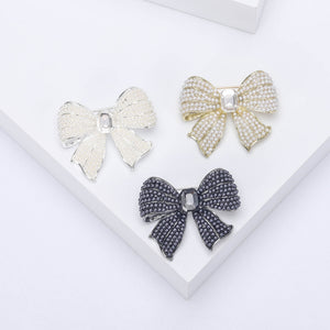 Faux Pearl Bow Brooch with Rectangular Center Rhinestone in Three Alloy Finishes