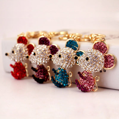 Four rhinestone mouse keychains displayed together in red, purple, blue, and pink.