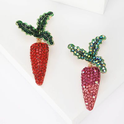 Front view of sparkling jeweled crystal carrot brooch in red and purple