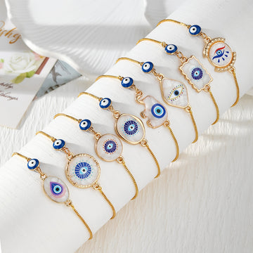 Gold Tone Blue Evil Eye Double Dangle Slider Bracelets
