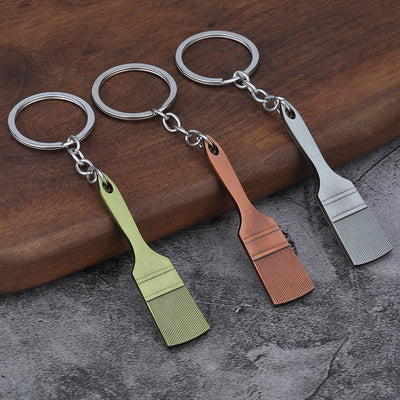 Shovel keychains in brass, copper and silver-tone finishes