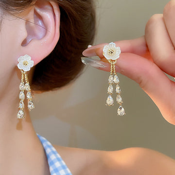 White Flower Crystal Tassel Earrings with Gold Tone Details