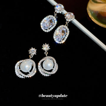 Silver Tone Clear Crystal Oval Drop Earrings in Two Designs